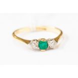 An 18ct gold emerald and diamond three stone claw ring, size S, total gross weight approx 3.