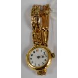An early 20th Century 18ct gold cased lady's wristwatch, engraved to reverse,