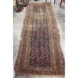 A hand knotted early 20th Century rug.