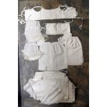 A collection of white wear babies cotton vests from 1842 to include baby cotton binders and cotton