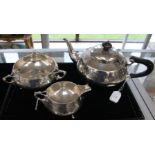 An Edwardian Arts and Crafts Sterling silver three piece tea service,