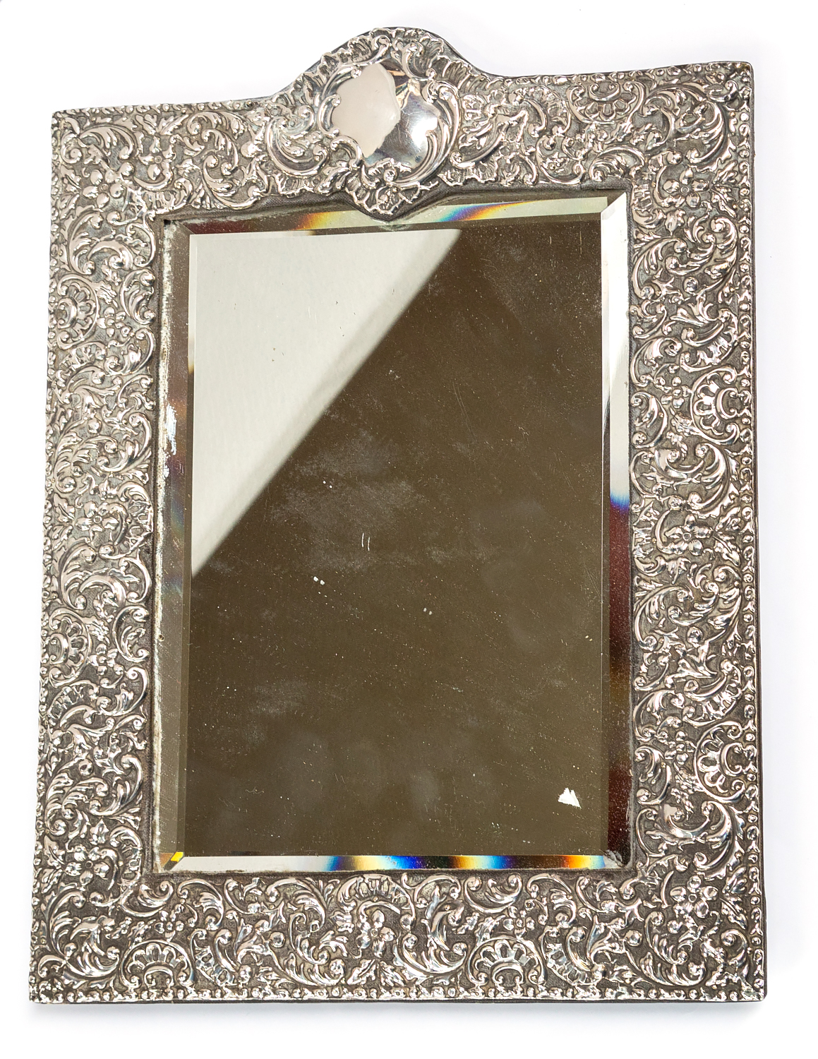 An Edwardian silver mounted easel shaped rectangular framed looking glass,