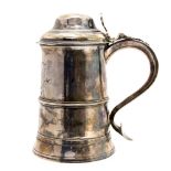 A George III silver tankard with dome top, cylindrical on spreading foot with applied central band,