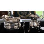 A George II silver baluster shaped cream jug, wavy rim, S-scroll handle on three trefoil feet,