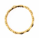 Graziella - an Italian 18ct gold necklace, having interlocking hollow triangulated form links,