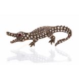 A diamond novelty crocodile yellow metal brooch, set with rose-cut diamonds approx 1 carat total,