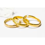 Three 22ct gold wedding bands, sizes, N, R1/2, M1/2, with a combined total gross weight approx 11.