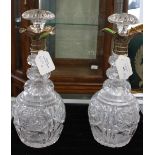 A pair of George VI hob nail cut glass baluster shaped decanters and stoppers,