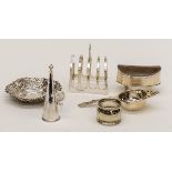A collection of table silver including: George III navette shaped salt; candle snuffer;