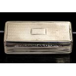 A William IV snuff box, shaped rectangular with engine turned decoration,