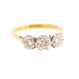 A diamond three-stone 18ct yellow gold ring, three round brilliant cut diamonds,