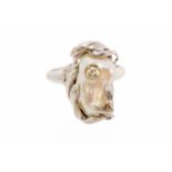 An 18ct white gold baroque pearl and diamond set designer ring,