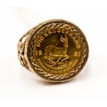 A 9ct ring mounted with 1/10 Krugerrand, dated 1981, finger size R,