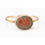 Roman (1st to 4th Century) Gold ring with an orange stone intaglio engraved with Pegasus.