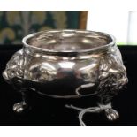 A George II large plain silver salt, raised border on three Lion's mask and paw feet, London,