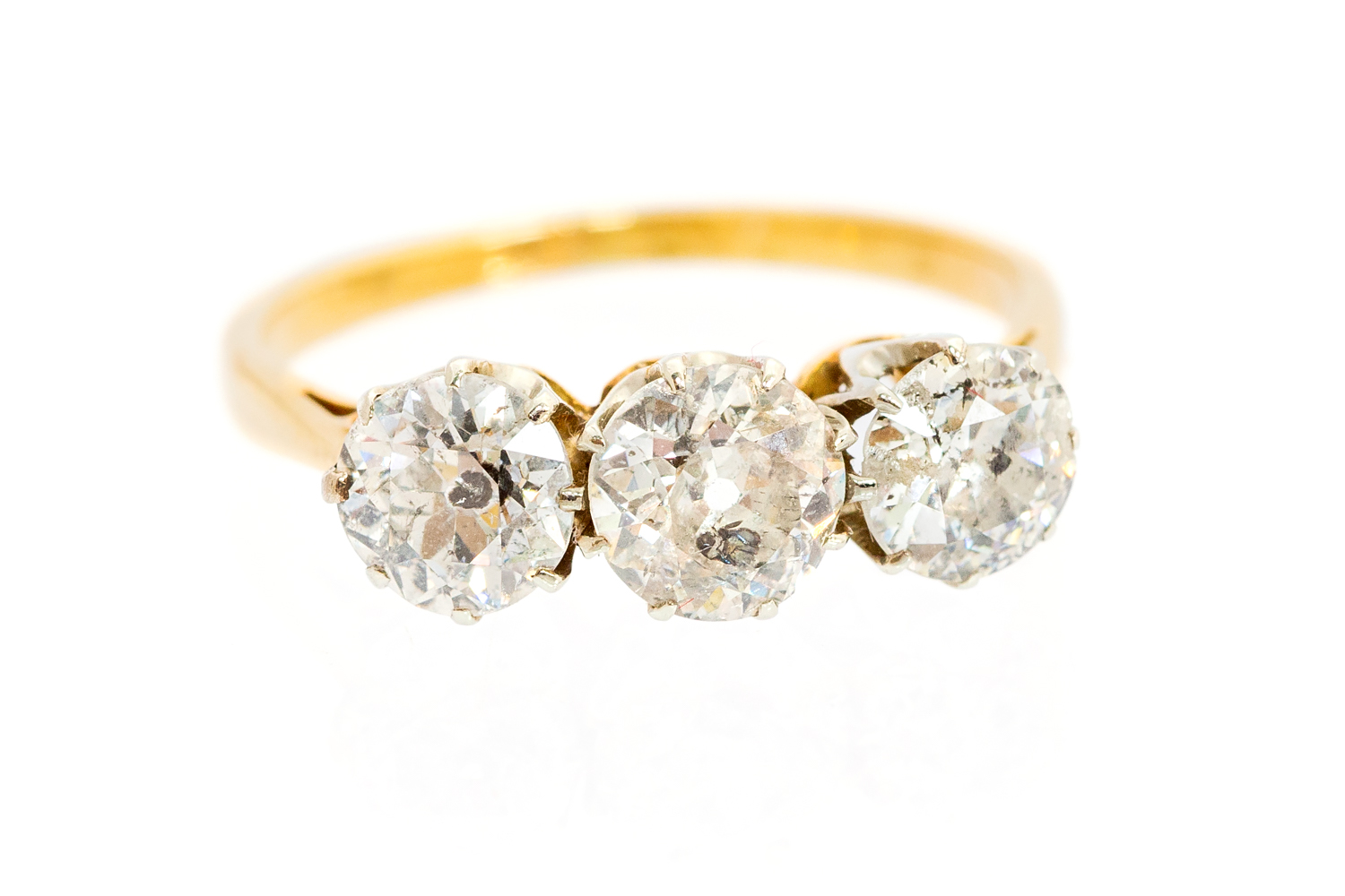 A diamond 18ct yellow gold three-stone ring,