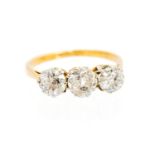 A diamond 18ct yellow gold three-stone ring,
