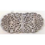 An Elizabeth II silver belt buckle, the body cast with scrolling foliage, rocaille and fan motifs,