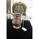 A George III style silver baluster cream jug, Birmingham 1975, makers mark for 'T Hill', 11cm high,