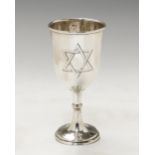 An early 20th Century silver wine goblet, the stem with central knop on circular foot,