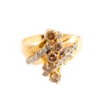 A champagne and white diamond fancy cluster 14k yellow gold ring,