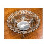 A George V silver pierced fruit bowl, standing on three scroll feet, Joseph Rodgers & Sons,