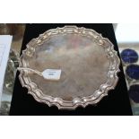 An Elizabeth II Walker and Hall silver card tray, Sheffield 1963, having a shaped pie crust edge,