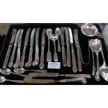 A miscellaneous collection of silver handled butter knives and spoons,