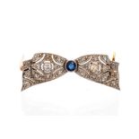 An Art Deco diamond and sapphire set bow brooch,