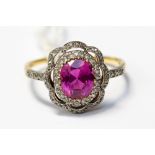 A synthetic ruby and diamond dress ring, with openwork flower design set with grain set diamonds,