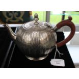 A Victorian silver tea pot, bullet shaped with chased flutes and engraved dot detail, London 1887,