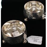 A pair of Victorian Aesthetic movement silver cauldron shaped salts,