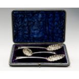 A pair of William IV silver berry spoons together with a matched Victorian sifter spoon,