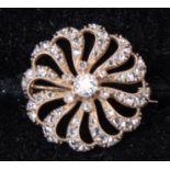 A diamond stylised flower head brooch, central round old-cut diamond approx 0.