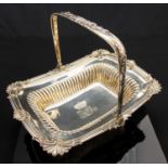 A George III silver fruit or bread basket, rectangular footed form with swing handle,