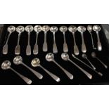 A large collection of mainly 19th Century silver fiddle pattern mustard and other condiment spoons,