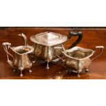 A George V sterling silver three piece tea set, comprising teapot,