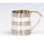 A George III silver quarter pint mug, with reeded sections, plain handle, marks rubbed, circa 1800,