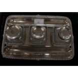 A George II silver inkstand, of rectangular outline with gadroon border,
