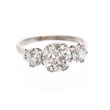 A diamond three-stone platinum ring, three round brilliant-cut diamonds,