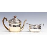 A George III bright-cut engraved silver teapot and two-handled sugar bowl, en suite,