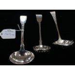 Three various silver sauce ladles, one chased as a berry spoon, various dates and makers (3) 4.