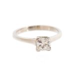 A diamond solitaire white gold ring, the princess-cut diamond accompanied by an EGL diamond report,