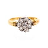 A diamond flower head cluster 18ct yellow gold ring,