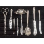 A collection of 20th Century North European silver and white metal including sifting spoon,