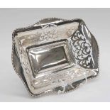 A George V Sterling silver pierced shaped rectangular dish, with egg and dart border,