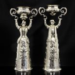 A pair of late 19th century Continental silver wager cups, modelled as a man and woman,