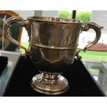 IRISH INTEREST: A George II Irish silver twin handled loving cup,