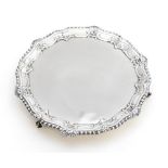 A George III silver salver, pie crust edge with gadrooned and shell decoration,