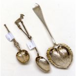 Three various silver spoons including: a late 19th Century Continental 800 standard heart shaped